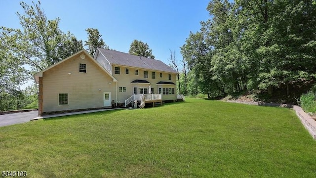 1121 N Washington Ave, Green Brook Twp, NJ 08812 - back of house featuring a yard and a wooden deck