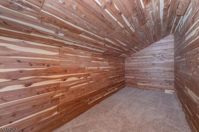bonus room with wooden walls, vaulted ceiling, wooden ceiling, and carpet floors