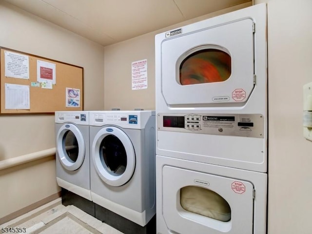 shared laundry area with washing machine and clothes dryer