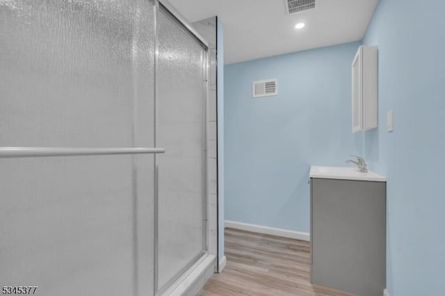 58 Meadowview Rd, Long Hill Twp, NJ 07946 - bathroom featuring a stall shower, visible vents, and wood finished floors