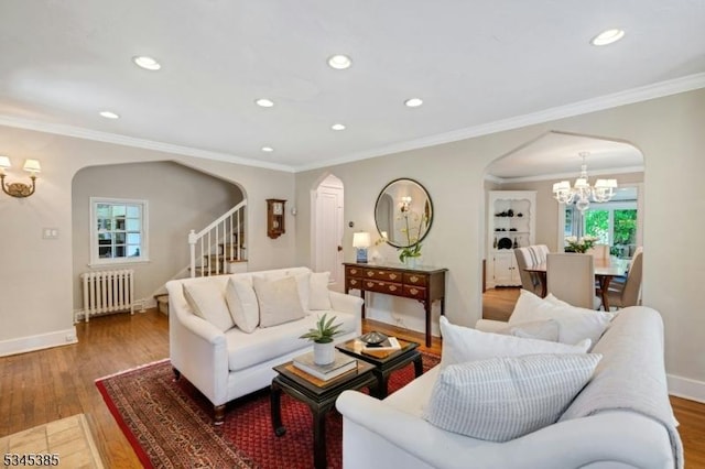 110 Kenilworth Rd, Mountain Lakes Boro, NJ 07046 - living area featuring arched walkways, radiator heating unit, a chandelier, recessed lighting, and wood finished floors