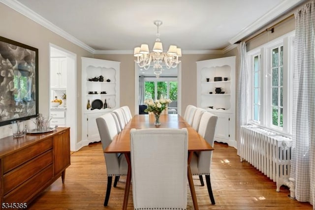 110 Kenilworth Rd, Mountain Lakes Boro, NJ 07046 - dining area with radiator heating unit, light wood-type flooring, a chandelier, and ornamental molding