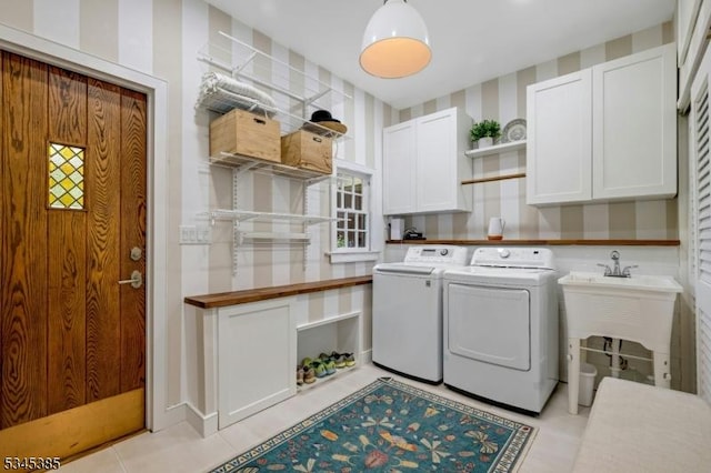 110 Kenilworth Rd, Mountain Lakes Boro, NJ 07046 - clothes washing area featuring cabinet space, washer and dryer, wallpapered walls, and light tile patterned floors