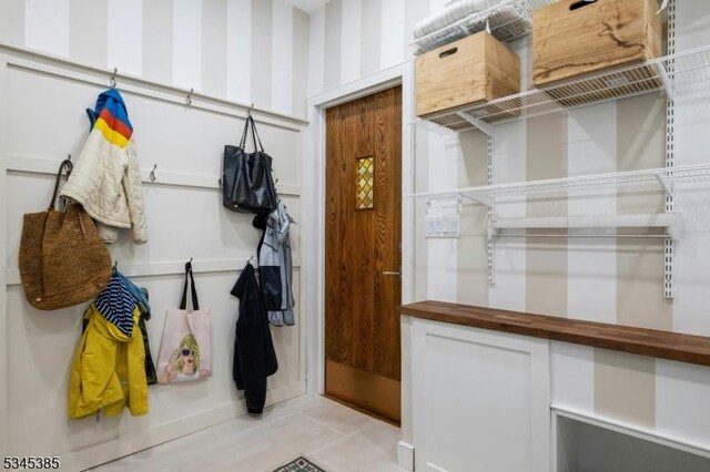 110 Kenilworth Rd, Mountain Lakes Boro, NJ 07046 - mudroom with wallpapered walls and light tile patterned floors