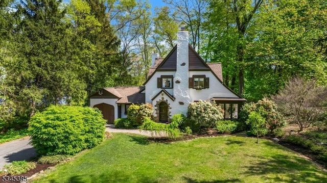 110 Kenilworth Rd, Mountain Lakes Boro, NJ 07046 - view of front of house featuring a chimney, a front lawn, and stucco siding