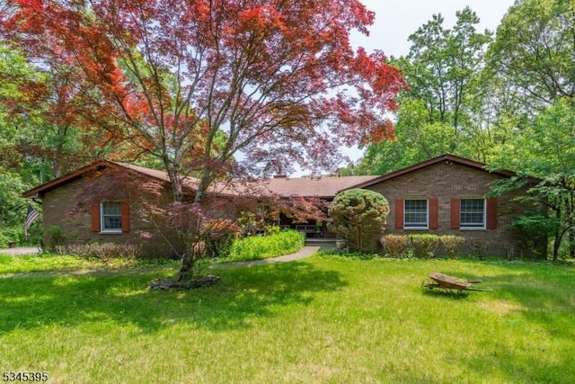 992 Stillwater Rd, Stillwater Twp, NJ 07860 - ranch-style home with a front lawn and brick siding