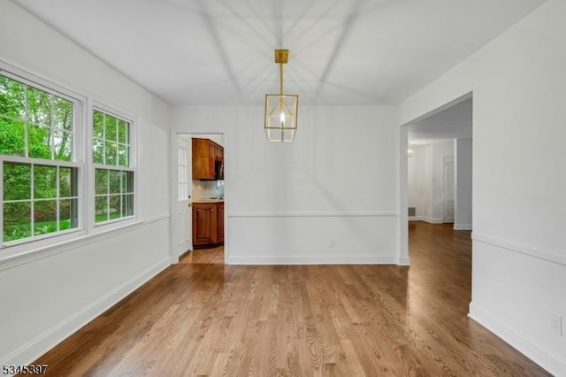 6 Ronarm Dr, Mountain Lakes Boro, NJ 07046 - unfurnished dining area with light wood-style flooring and baseboards