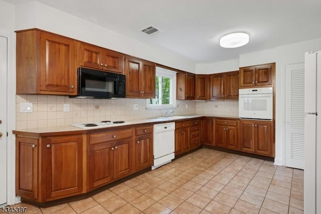 6 Ronarm Dr, Mountain Lakes Boro, NJ 07046 - kitchen with white appliances, backsplash, light countertops, a sink, and brown cabinetry