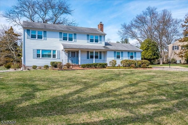 31 Riverview Ter, Hillsborough Twp, NJ 08844 - view of front of house with a front yard, covered porch, and a chimney