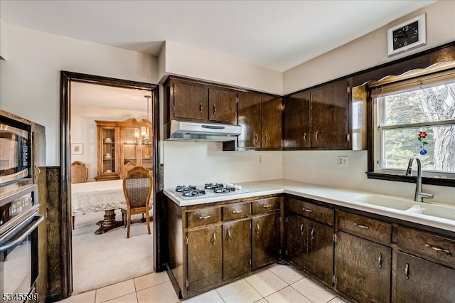 31 Riverview Ter, Hillsborough Twp, NJ 08844 - kitchen featuring under cabinet range hood, stainless steel microwave, a sink, wall oven, and white gas stovetop