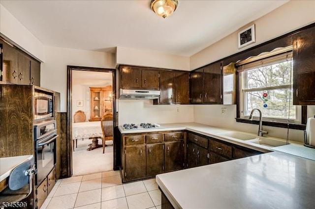 31 Riverview Ter, Hillsborough Twp, NJ 08844 - kitchen with stainless steel microwave, oven, white gas cooktop, under cabinet range hood, and a sink