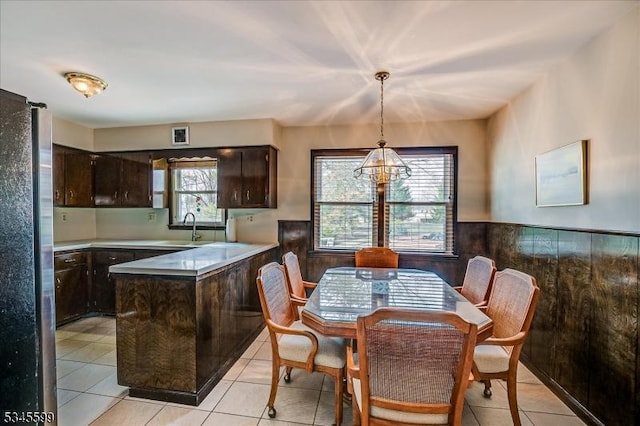 31 Riverview Ter, Hillsborough Twp, NJ 08844 - dining area featuring light tile patterned floors, visible vents, and a wainscoted wall
