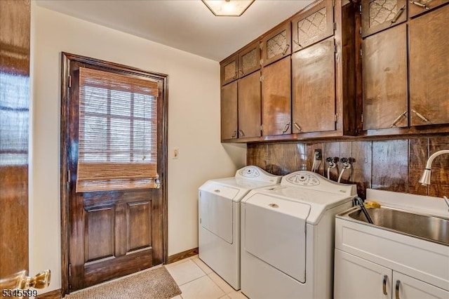31 Riverview Ter, Hillsborough Twp, NJ 08844 - laundry room with light tile patterned floors, baseboards, cabinet space, separate washer and dryer, and a sink