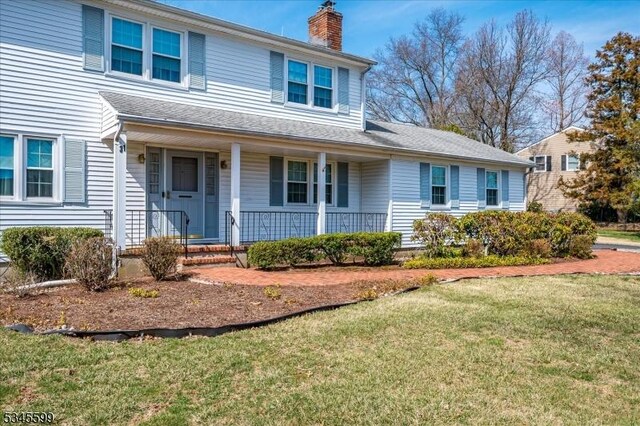 31 Riverview Ter, Hillsborough Twp, NJ 08844 - view of front of property featuring covered porch, a chimney, a front yard, and a shingled roof
