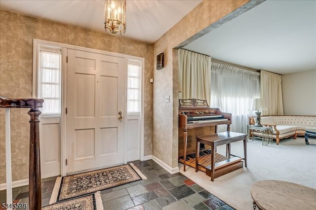 31 Riverview Ter, Hillsborough Twp, NJ 08844 - entryway with baseboards, an inviting chandelier, and stone tile flooring