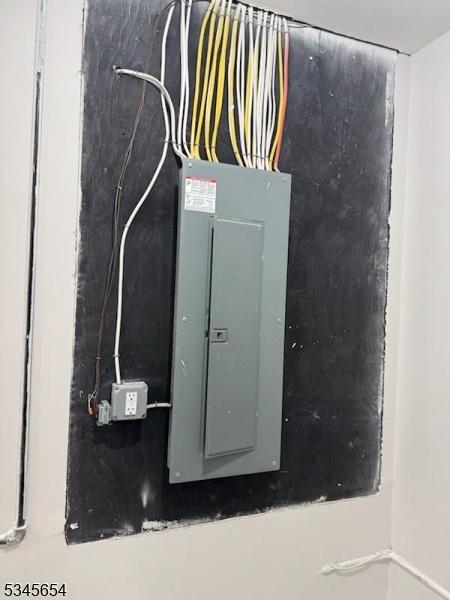 utility room featuring electric panel