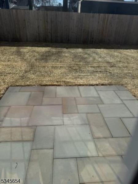 view of yard featuring a patio area and fence