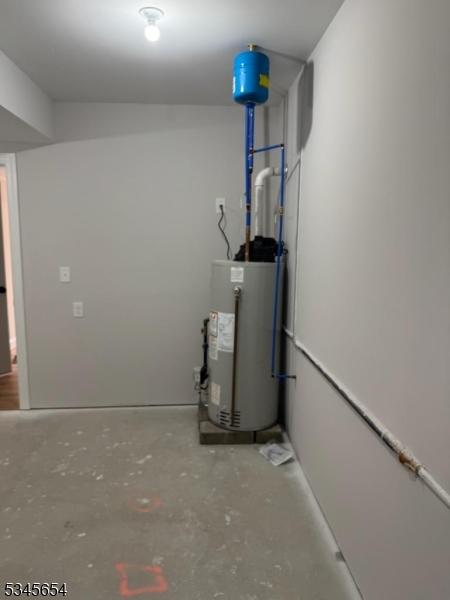 utility room with water heater