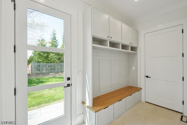 mudroom with a healthy amount of sunlight and light tile patterned floors