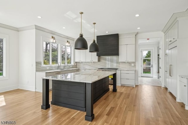 kitchen with tasteful backsplash, custom exhaust hood, recessed lighting, and white cabinets