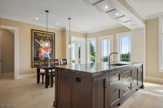 16 Laurel Mountain Way, Tewksbury Twp, NJ 07830 - kitchen with crown molding, a kitchen island with sink, dark stone counters, a sink, and pendant lighting