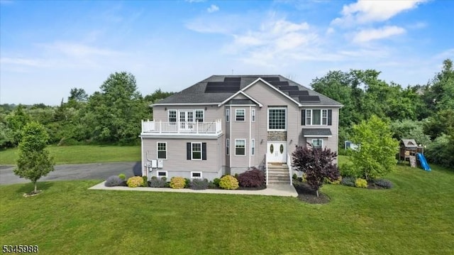 10 County Road 519, Hampton Twp, NJ 07860 - view of front of property with a balcony, solar panels, a front yard, and a playground