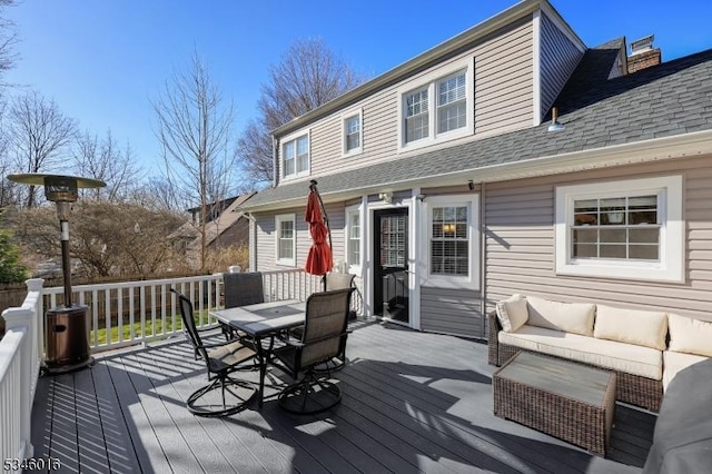 deck featuring outdoor dining space and an outdoor living space