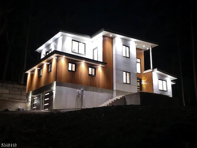 view of property exterior at night