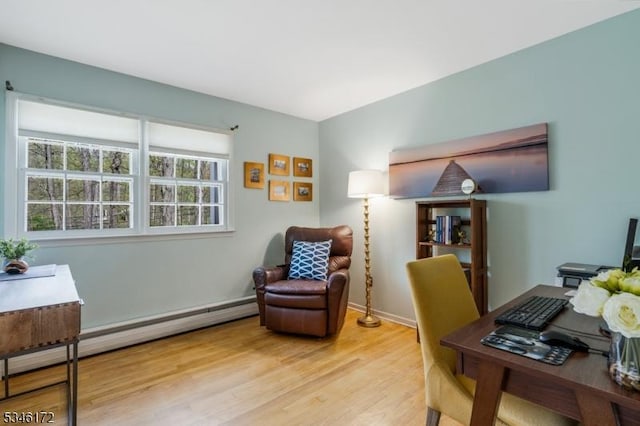 office with a baseboard radiator, wood finished floors, and a wealth of natural light