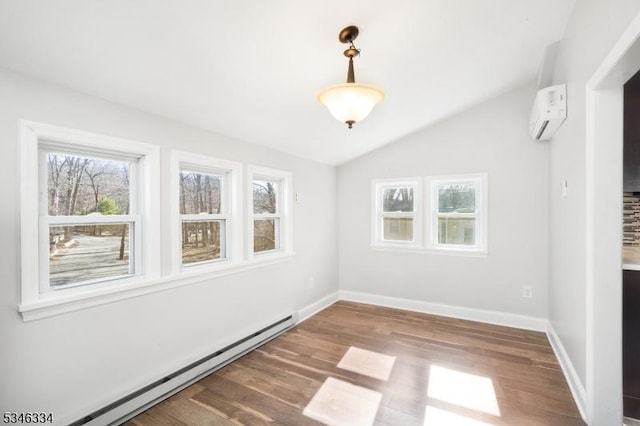 unfurnished room featuring a wall mounted AC, wood finished floors, vaulted ceiling, and a baseboard radiator