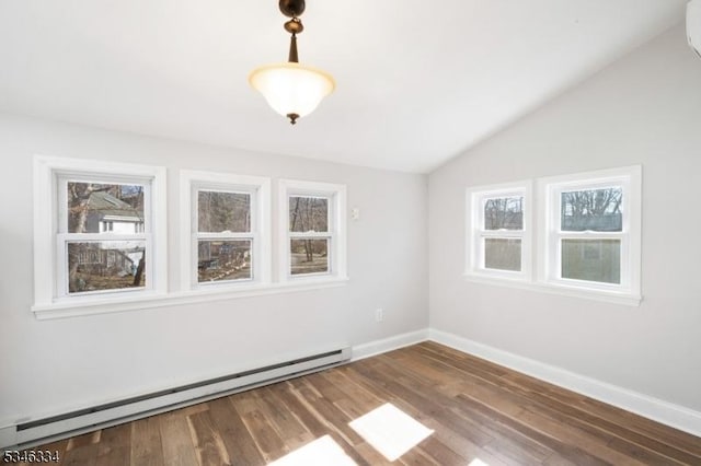 unfurnished room featuring dark wood-type flooring, lofted ceiling, a wealth of natural light, and a baseboard heating unit