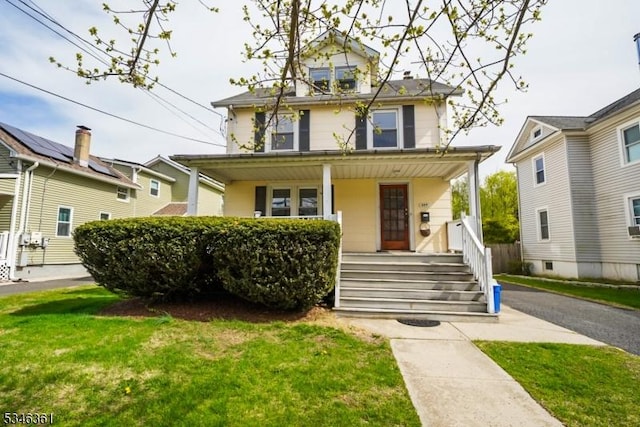 649 N Avenue Ext, Dunellen Boro, NJ 08812 - american foursquare style home featuring a porch and a front lawn