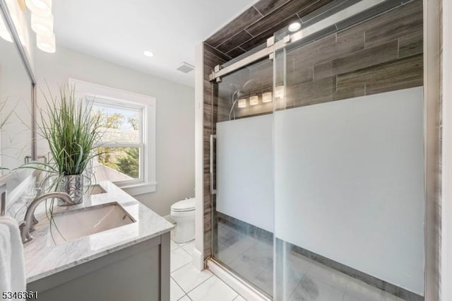 649 N Avenue Ext, Dunellen Boro, NJ 08812 - full bathroom featuring a stall shower, double vanity, toilet, recessed lighting, and tile patterned floors
