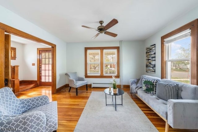 649 N Avenue Ext, Dunellen Boro, NJ 08812 - living room with a baseboard radiator, a ceiling fan, baseboards, and wood finished floors