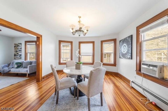 649 N Avenue Ext, Dunellen Boro, NJ 08812 - dining space featuring a baseboard heating unit, a chandelier, and healthy amount of natural light