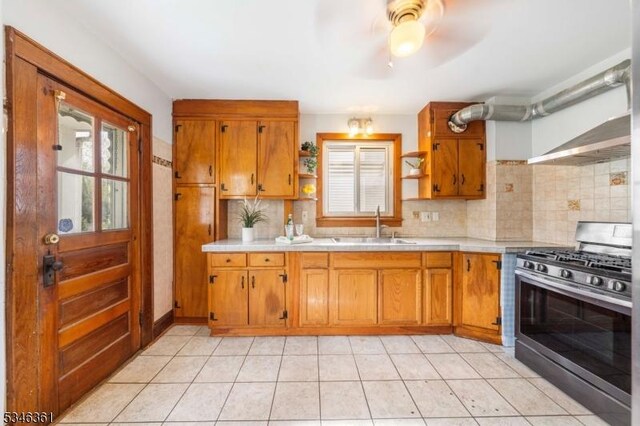 649 N Avenue Ext, Dunellen Boro, NJ 08812 - kitchen with gas stove, open shelves, healthy amount of natural light, and light countertops