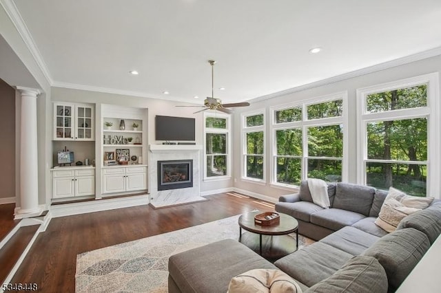 15 Wolfe Run Ct, Washington Twp, NJ 07853 - living room with decorative columns, ornamental molding, dark wood-style floors, a ceiling fan, and a fireplace