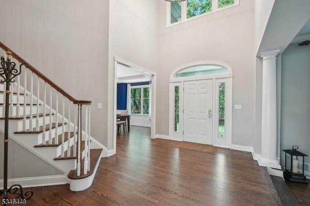 15 Wolfe Run Ct, Washington Twp, NJ 07853 - foyer featuring decorative columns, wood finished floors, stairway, baseboards, and a towering ceiling
