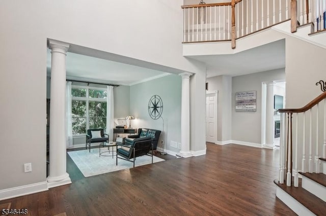 15 Wolfe Run Ct, Washington Twp, NJ 07853 - foyer entrance with decorative columns, stairs, wood finished floors, baseboards, and a high ceiling