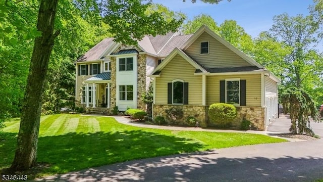 15 Wolfe Run Ct, Washington Twp, NJ 07853 - view of front of property featuring stone siding, a front yard, a garage, and driveway