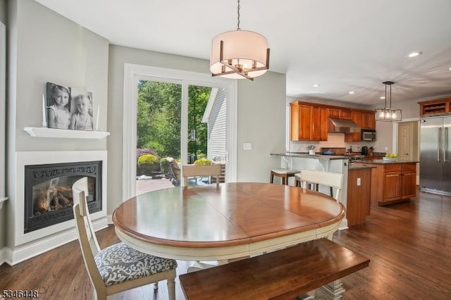 15 Wolfe Run Ct, Washington Twp, NJ 07853 - dining room with dark wood-style floors, recessed lighting, a glass covered fireplace, and a chandelier
