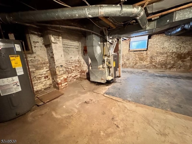 74 Union St, Hackensack City, NJ 07601 - unfinished basement featuring water heater and heating unit