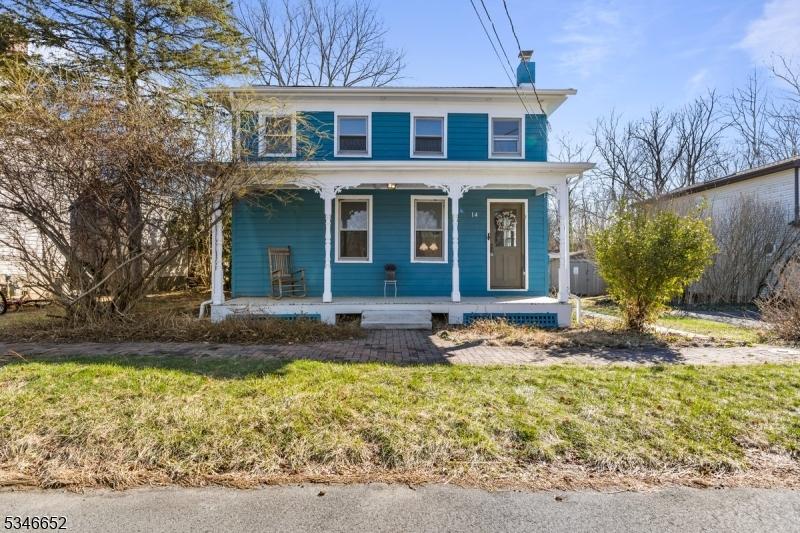 14 Adams St, Belvidere Twp, NJ 07823 - american foursquare style home featuring a front lawn, a chimney, and a porch