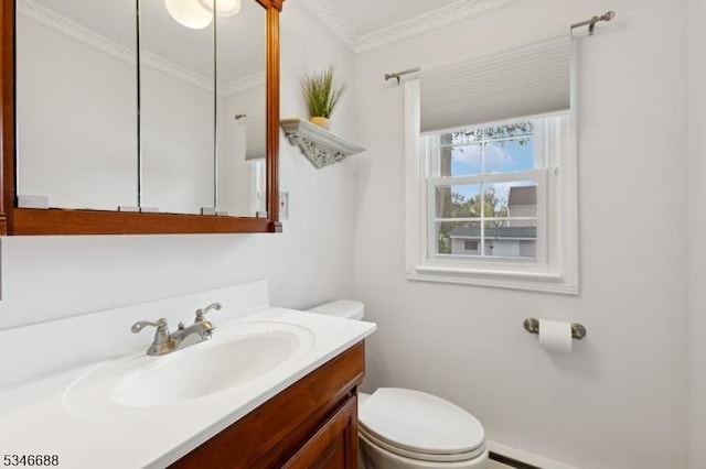 bathroom featuring a baseboard heating unit, toilet, baseboards, vanity, and ornamental molding
