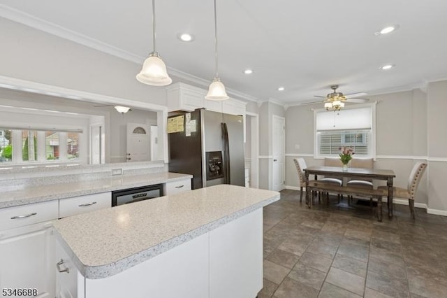 kitchen with recessed lighting, black dishwasher, light countertops, and stainless steel fridge