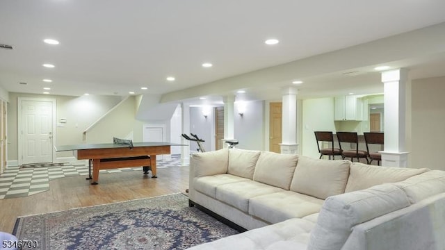 living area featuring recessed lighting, pool table, ornate columns, and light wood-style flooring