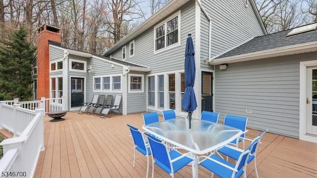 wooden terrace with outdoor dining area