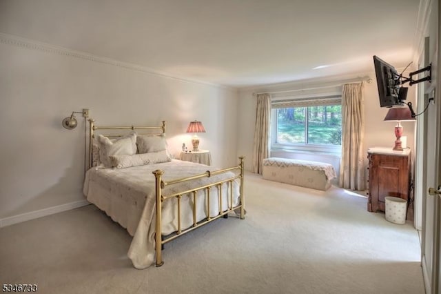 bedroom featuring carpet floors and crown molding