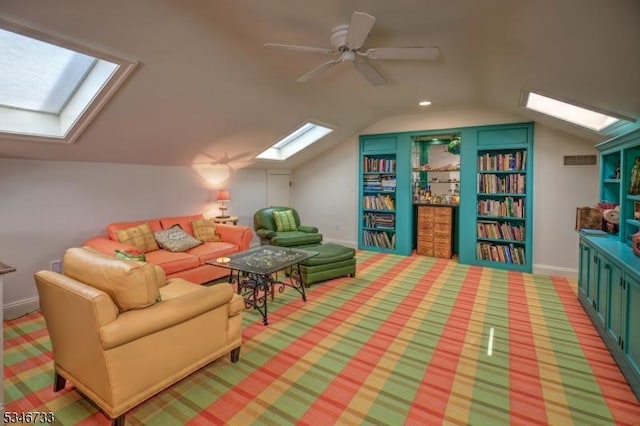 additional living space with light colored carpet, a ceiling fan, recessed lighting, visible vents, and lofted ceiling with skylight