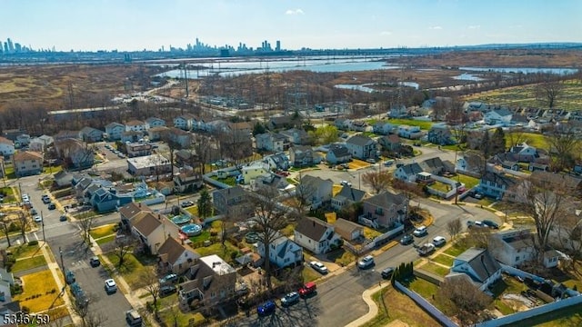 drone / aerial view with a view of city and a water view